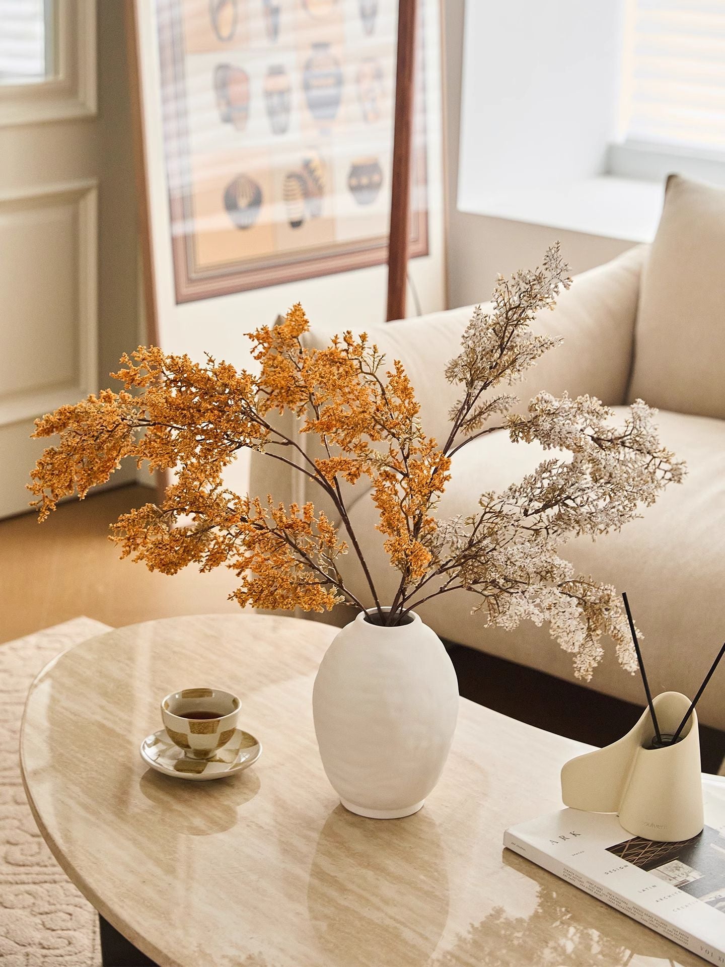 Ridged oval ceramic vase displayed on a table