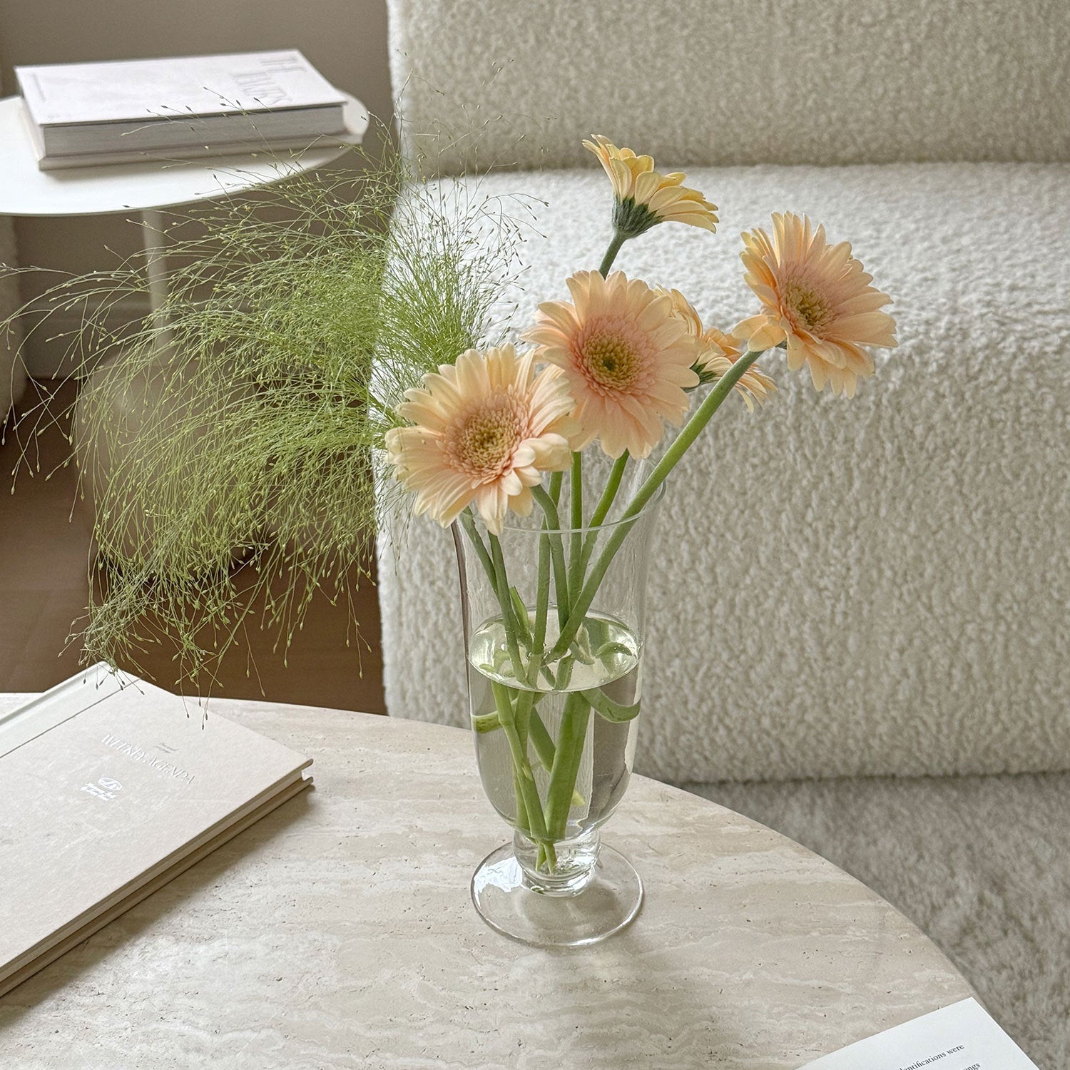 Footed glass vase displayed on a dining table
