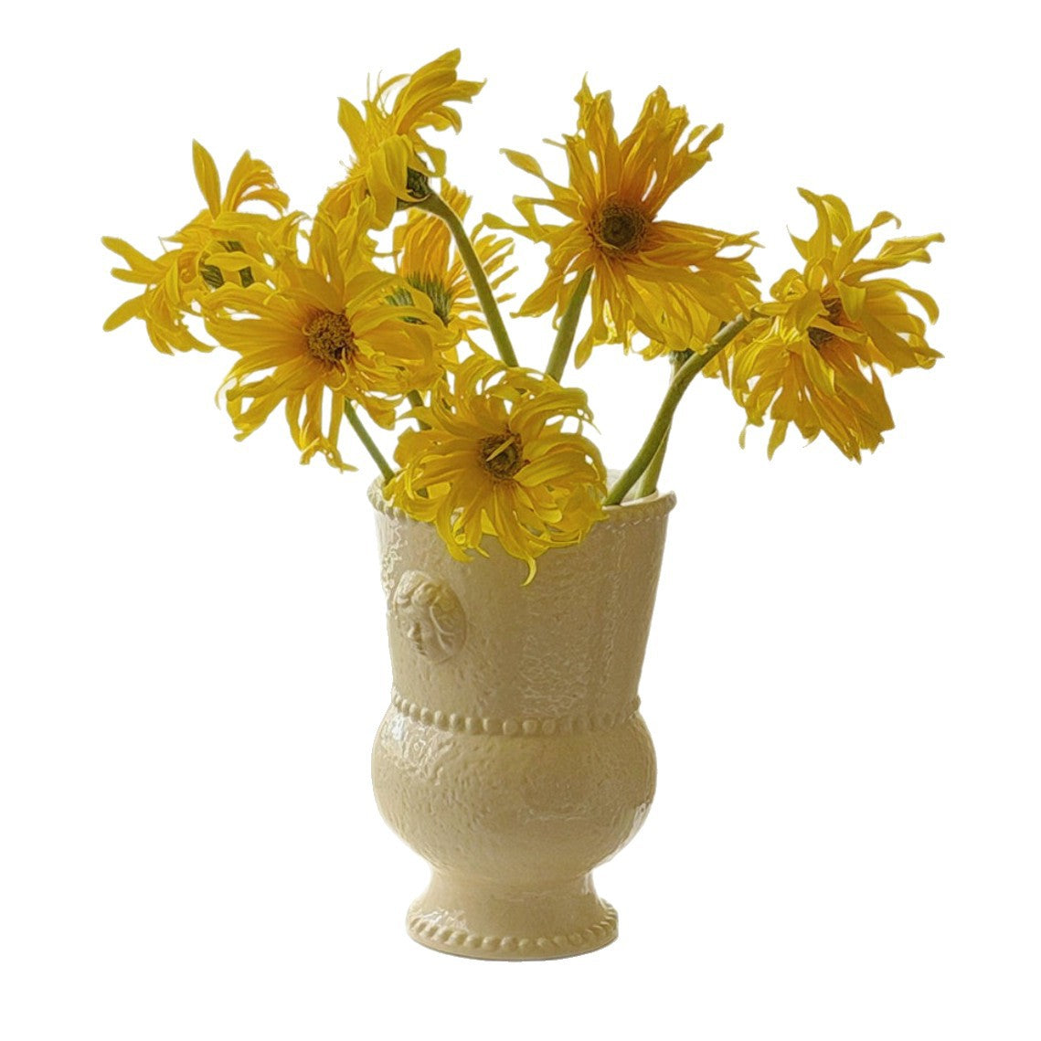 Embossed ceramic vase displayed on a table