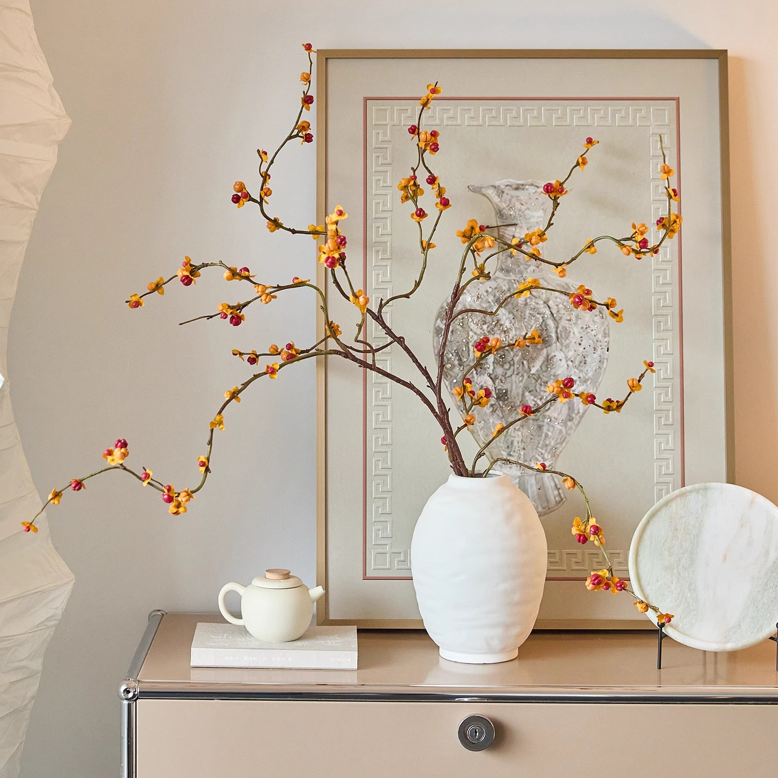 Ridged oval ceramic vase displayed on a cabinet