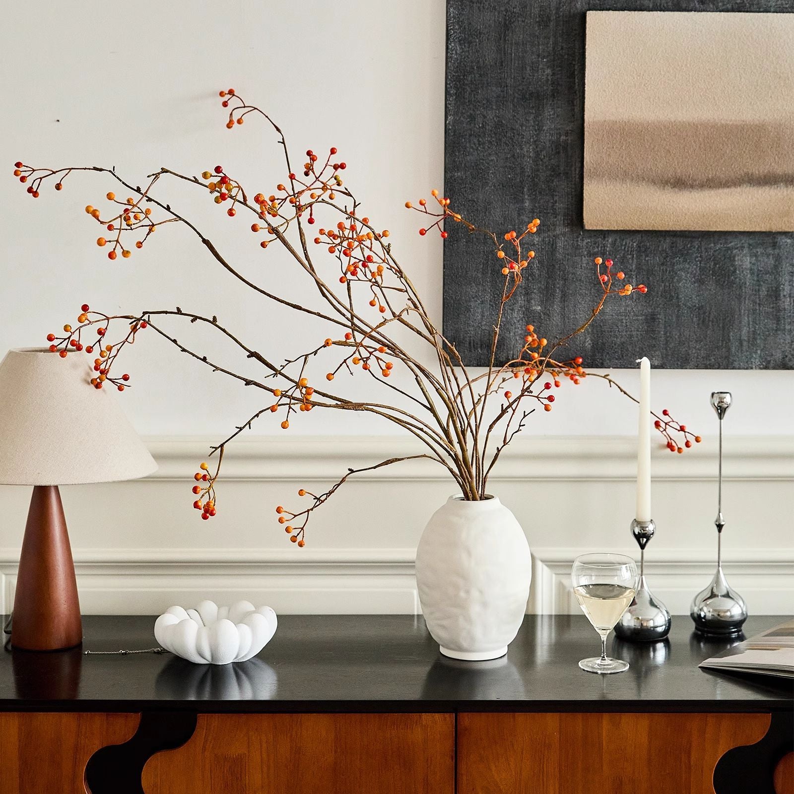 Ridged oval ceramic vase displayed on a console table