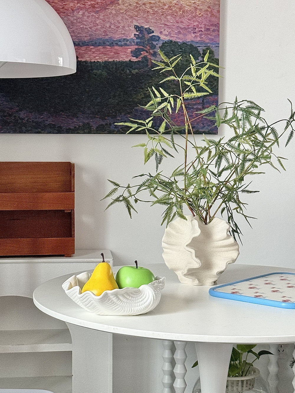 Ruffled wave ceramic vase used as an indoor decorative vase