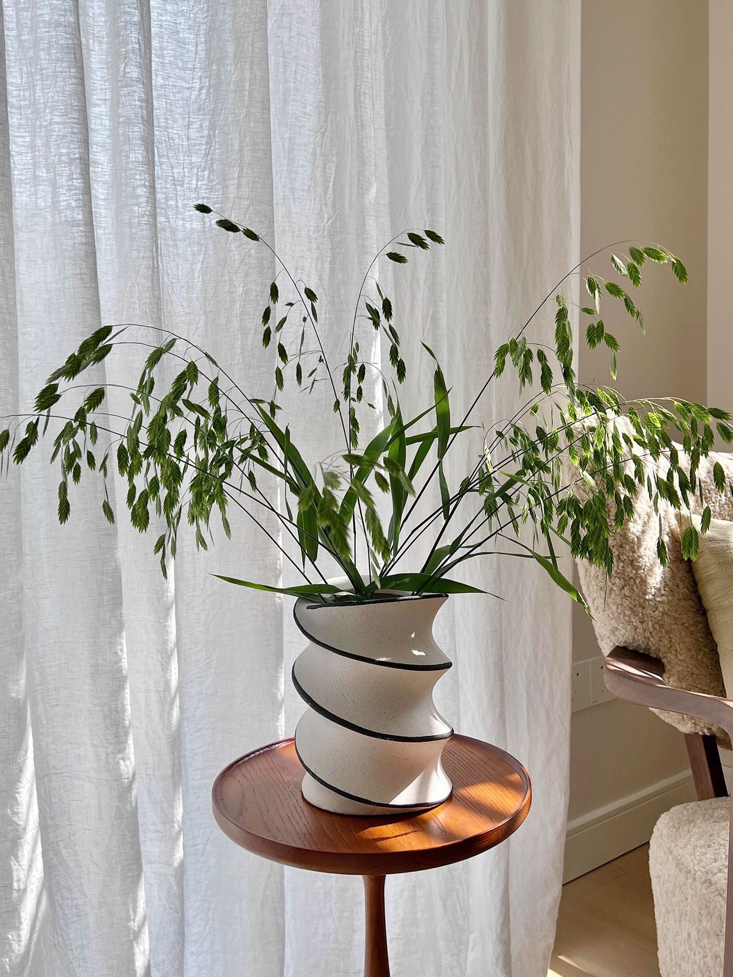 Spiral ceramic decorative vase in an interior setting